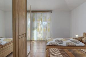 Postel nebo postele na pokoji v ubytování Villa Mateja
