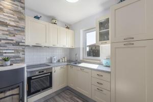 Kuchyň nebo kuchyňský kout v ubytování Apartment Marjan