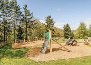 a park with a playground with a slide at Hillcroft Park in Pooley Bridge