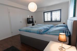 Кровать или кровати в номере Ferienwohnung Offermann