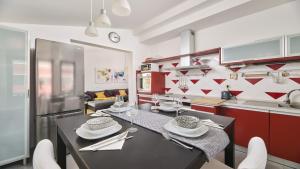 a kitchen with a table with wine glasses on it at Apartment Iriska in Novigrad Istria