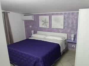 En eller flere senge i et værelse på CASA VIA ALVARO