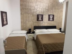Postel nebo postele na pokoji v ubytování CASA VIA ALVARO