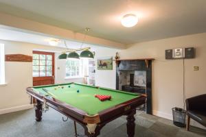 a living room with a pool table in it at Rossie Ochil House with Hot Tub in Forgandenny