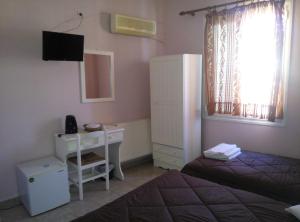 Postel nebo postele na pokoji v ubytování Hera Hotel