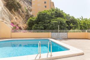 a swimming pool in front of a building at Pierre & Vacances Altea Beach - Port in Altea