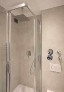 a shower with a glass shower stall in a bathroom at SweetHome - Luxus pur - Küche, Balkon, WiFi in Dachau