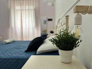 Postel nebo postele na pokoji v ubytování Meta Salento Rooms