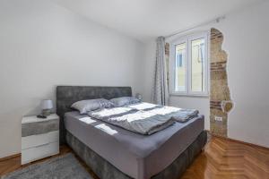 Postel nebo postele na pokoji v ubytování Penthouse Lorena