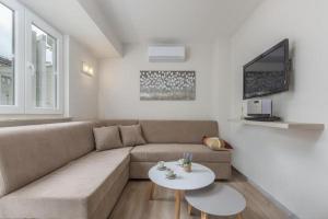 a living room with a couch and a table at Apartment Ida in Novigrad Istria