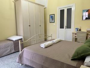 Postel nebo postele na pokoji v ubytování Meta Salento Rooms
