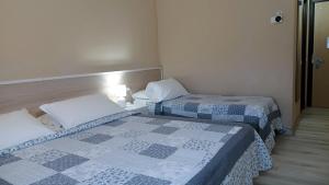 Postel nebo postele na pokoji v ubytování Hotel Al Sant'Andrea