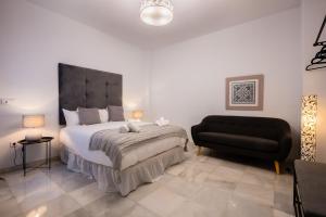 A bed or beds in a room at Apartamentos Cruz de San Andrés