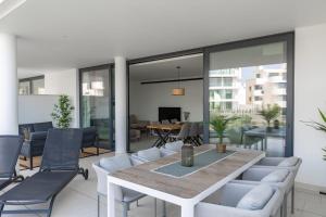 a living room with a table and chairs at Modern 2 bedroom luxury apartment in Higueron West in Fuengirola