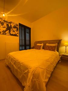 Voodi või voodid majutusasutuse B&B Art and Sleep toas