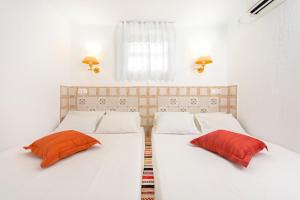 Postel nebo postele na pokoji v ubytování Petra House Karpathos + 17 fotografií
