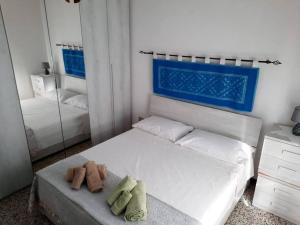 Postel nebo postele na pokoji v ubytování Dommu Biddasusu