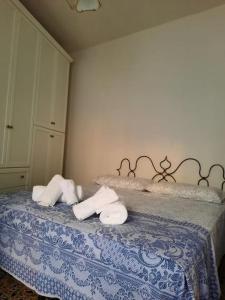 Postel nebo postele na pokoji v ubytování Dommu Biddasusu
