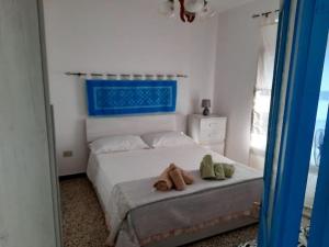Postel nebo postele na pokoji v ubytování Dommu Biddasusu