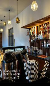 a bar with a wooden bar is open everyday at Tsaghkadzor apartment Kechi House in Tsaghkadzor
