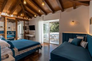 a bedroom with a bed and a couch at Villa Antiche Mura Relais in Sorrento