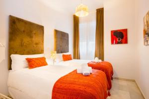 A bed or beds in a room at Apartamentos Cruz de San Andrés