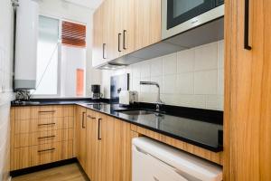 A kitchen or kitchenette at Apartamentos Cruz de San Andrés