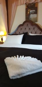 Postel nebo postele na pokoji v ubytování Odos Oneiron Boutique Hotel
