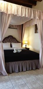 Postel nebo postele na pokoji v ubytování Odos Oneiron Boutique Hotel