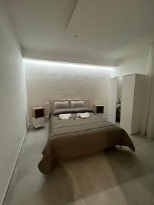 a bedroom with a large bed in a room at Campione 5 in Bari