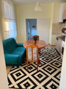 a living room with a table and a couch at Wohnung 18 in Lutherstadt Eisleben