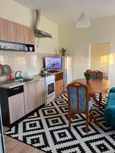 a kitchen with a table and a dining room at Wohnung 18 in Lutherstadt Eisleben