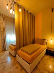 a bedroom with two beds and a window at Zeljko's luxury hostel in Vicenza