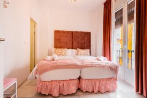 A bed or beds in a room at Apartamentos Cruz de San Andrés