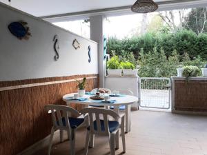 a patio with a table and chairs and a window at Le Barchette in San Cataldo +88 photos