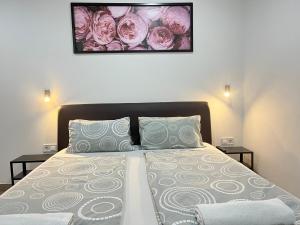 A bed or beds in a room at Attila Studio Apartments