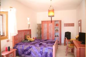 A bed or beds in a room at Oasi Beach Hotel