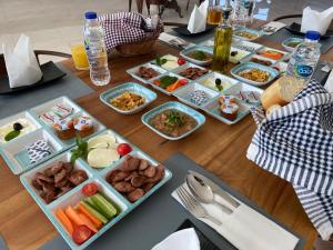 a table with many dishes of food on it at Turquoise Resorts in Ruwais