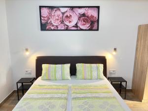 A bed or beds in a room at Attila Studio Apartments