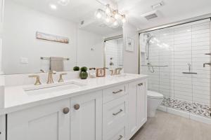 a white bathroom with a sink and a toilet at Sst3 #1209 in Marco Island