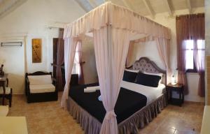 Postel nebo postele na pokoji v ubytování Odos Oneiron Boutique Hotel