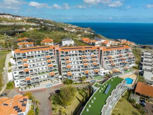 an aerial view of a resort near the ocean at Apartment Nata by Holiday Rental Madeira in Caniço