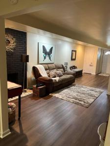 a living room with a couch and a fireplace at Hilltop Hideaway - 3BDR in Downtown London, KY in London