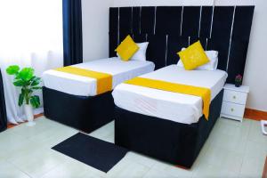 Cama o camas de una habitación en Best rated Garden Estate 2 bedroom