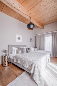 Posteľ alebo postele v izbe v ubytovaní GOING TRIPLE A apartments NORTH