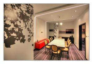 a dining room with a table and chairs at Villa Park in Siedlce +29 photos