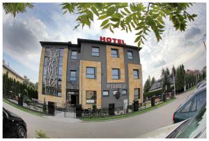 a hotel building with a sign on top of it at Villa Park in Siedlce