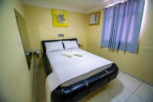 Postel nebo postele na pokoji v ubytování Hotel Pirâmide Rodoviária