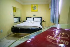 Postel nebo postele na pokoji v ubytování Hotel Pirâmide Rodoviária