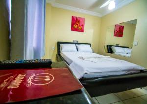 Postel nebo postele na pokoji v ubytování Hotel Pirâmide Rodoviária